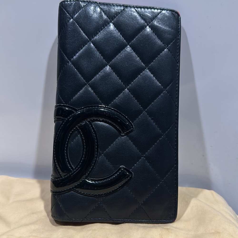 Pre owned and loved Chanel wallet with black patent CC.